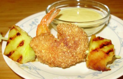 Curried granola-crusted shrimp with grilled pineapple.