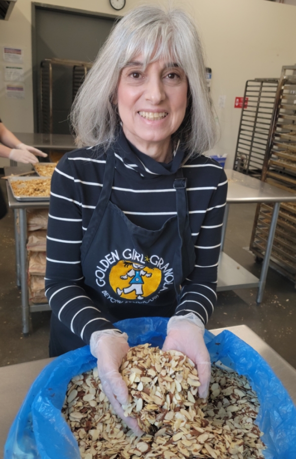 Owner Deborah O'Kelly with sliced almonds
