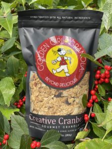 Creative Cranberry granola bag surrounded by berries